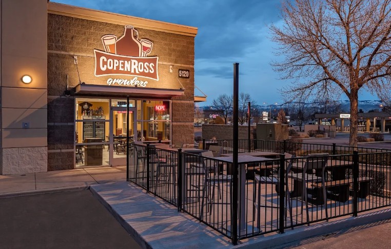 CopenRoss Exterior view of Copper Ross Wraylers restaurant with outdoor patio seating at dusk